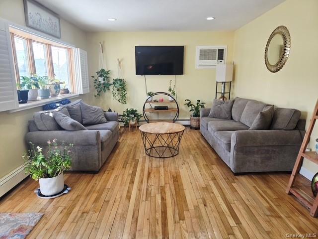 6 East Kissimee Road Lindenhurst, NY 11757 - Photo 4 of 15 a living room with furniture and a flat screen tv