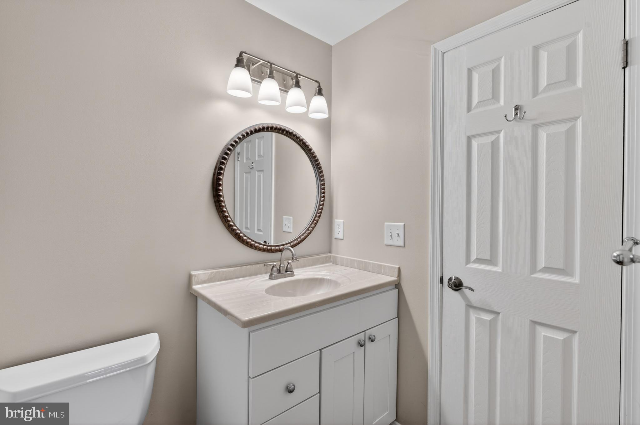 6 Nearfield Road Lutherville-Timonium, MD 21093 - Photo 54 of 71 a bathroom with a toilet sink and mirror