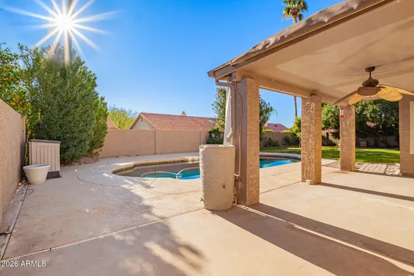 a view of swimming pool with a yard