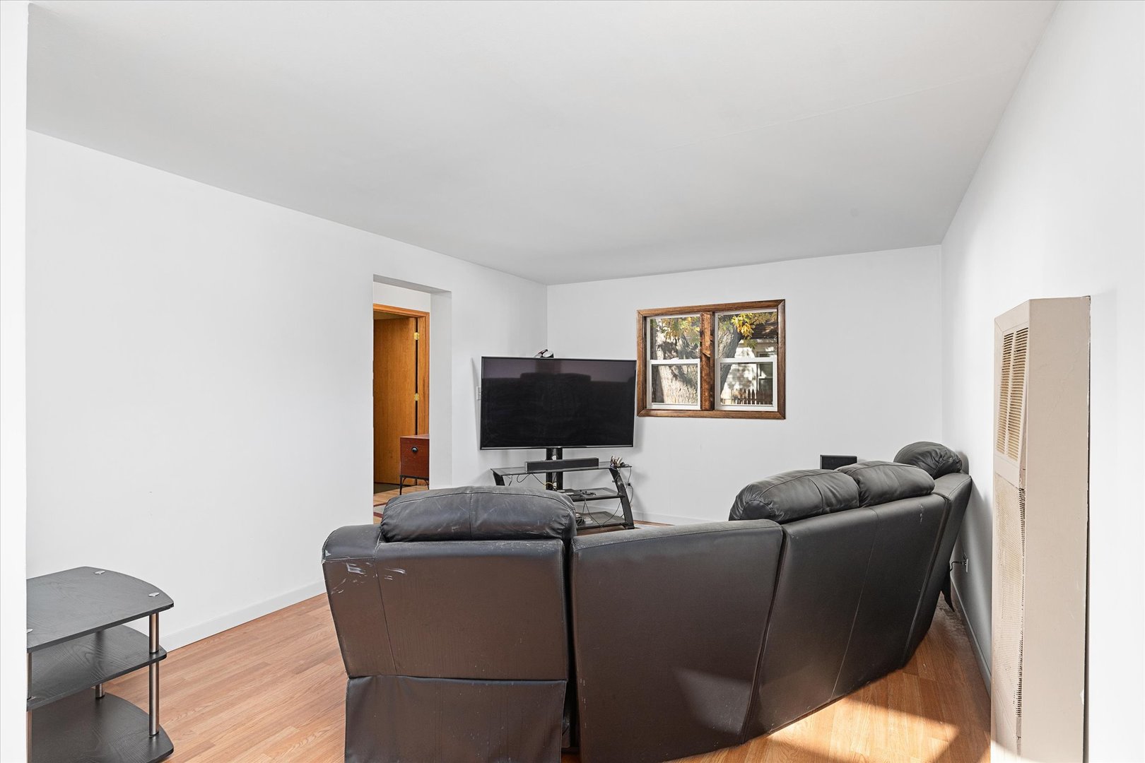 6236 Washington Street Chicago Ridge, IL 60415 - Photo 11 of 32 a living room with furniture and a flat screen tv