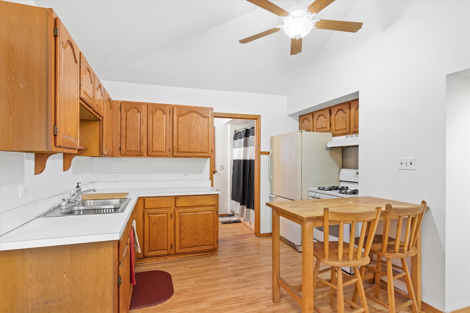 6236 Washington Street Chicago Ridge, IL 60415 - Photo 16 of 32 a kitchen with a sink and cabinets