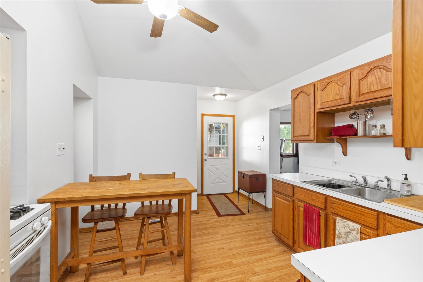 6236 Washington Street Chicago Ridge, IL 60415 - Photo 18 of 32 a kitchen with stainless steel appliances granite countertop a stove a sink and a refrigerator