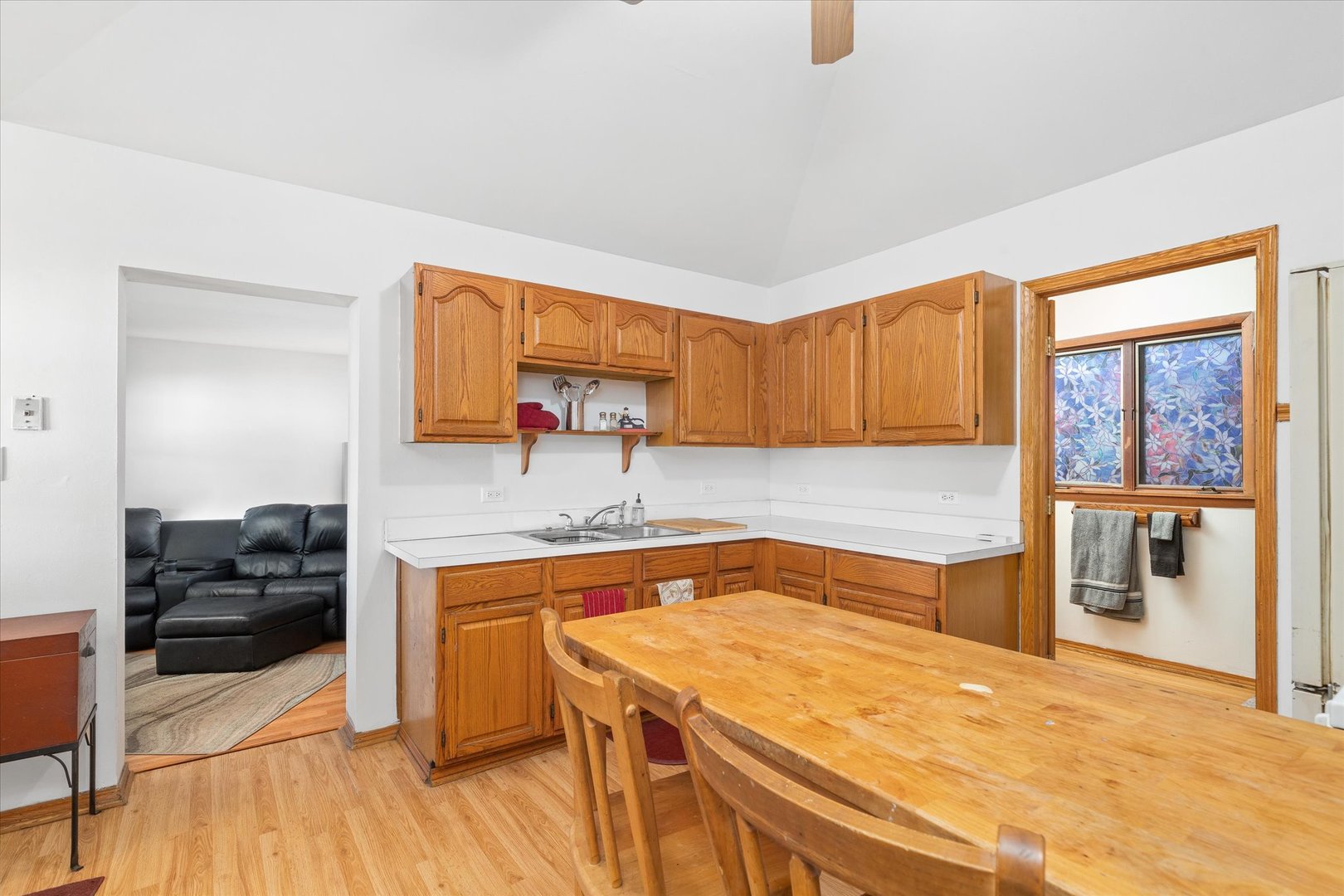 6236 Washington Street Chicago Ridge, IL 60415 - Photo 19 of 32 a kitchen with a sink a stove and cabinets