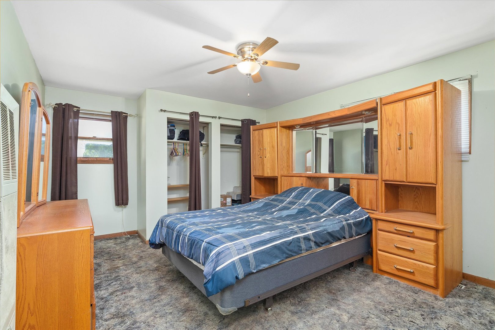 6236 Washington Street Chicago Ridge, IL 60415 - Photo 20 of 32 a bedroom with a bed and dresser with wooden floor