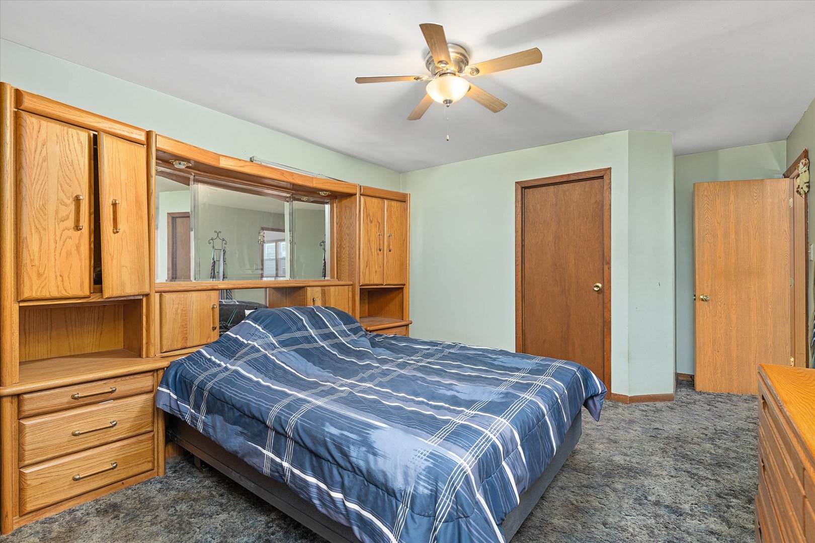 6236 Washington Street Chicago Ridge, IL 60415 - Photo 21 of 32 a bedroom with a large bed and a chandelier