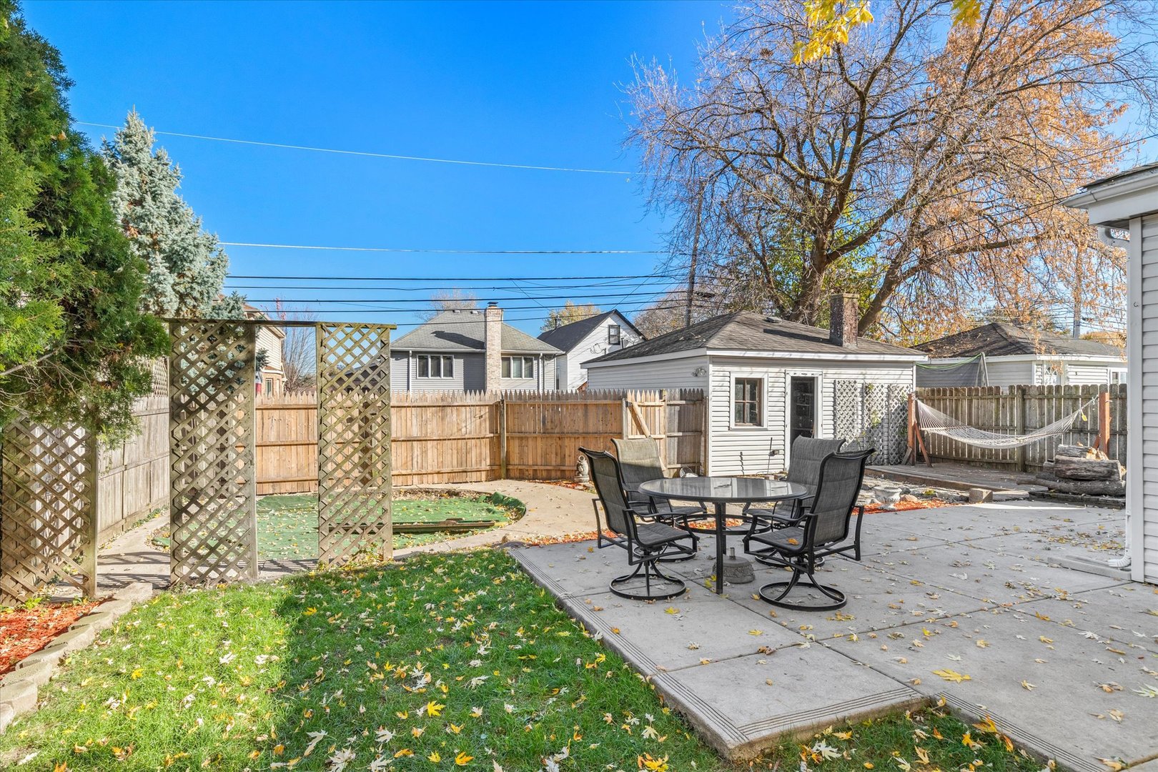 6236 Washington Street Chicago Ridge, IL 60415 - Photo 29 of 32 a view of a patio with table and chairs and floor to ceiling window