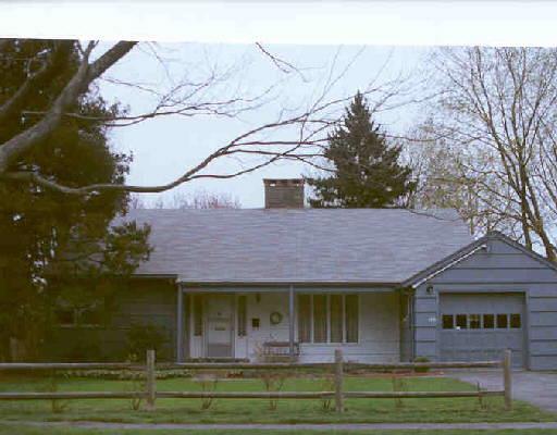 586 Beach Road Fairfield, CT 06824 - Photo 1 of 1 a front view of a house with a garden