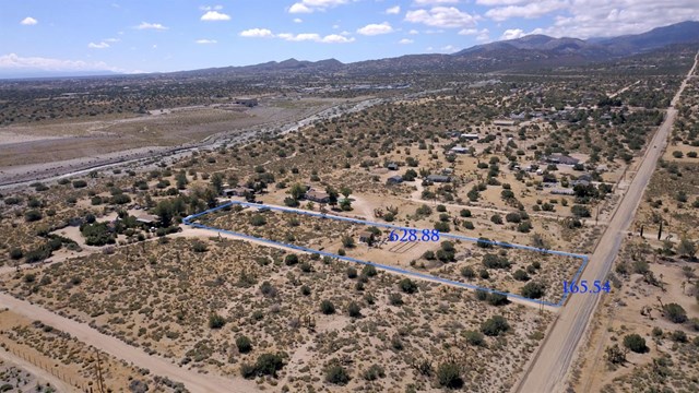 10405 Silver Rock Road Pinon Hills, CA 92372 - Photo 1 of 1 an aerial view of house with yard and mountain view in back