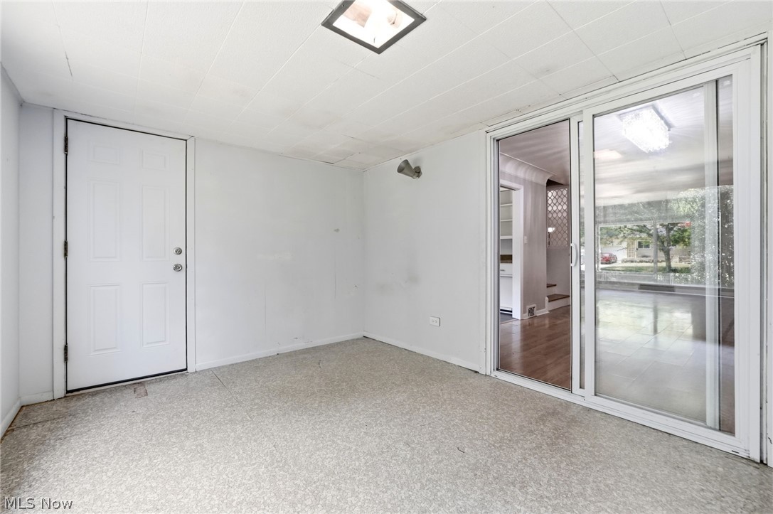 2537 Edgewood Road Beachwood, OH 44122 - Photo 22 of 39 Interior room featuring white walls, textured ceiling panels, and a patterned floor