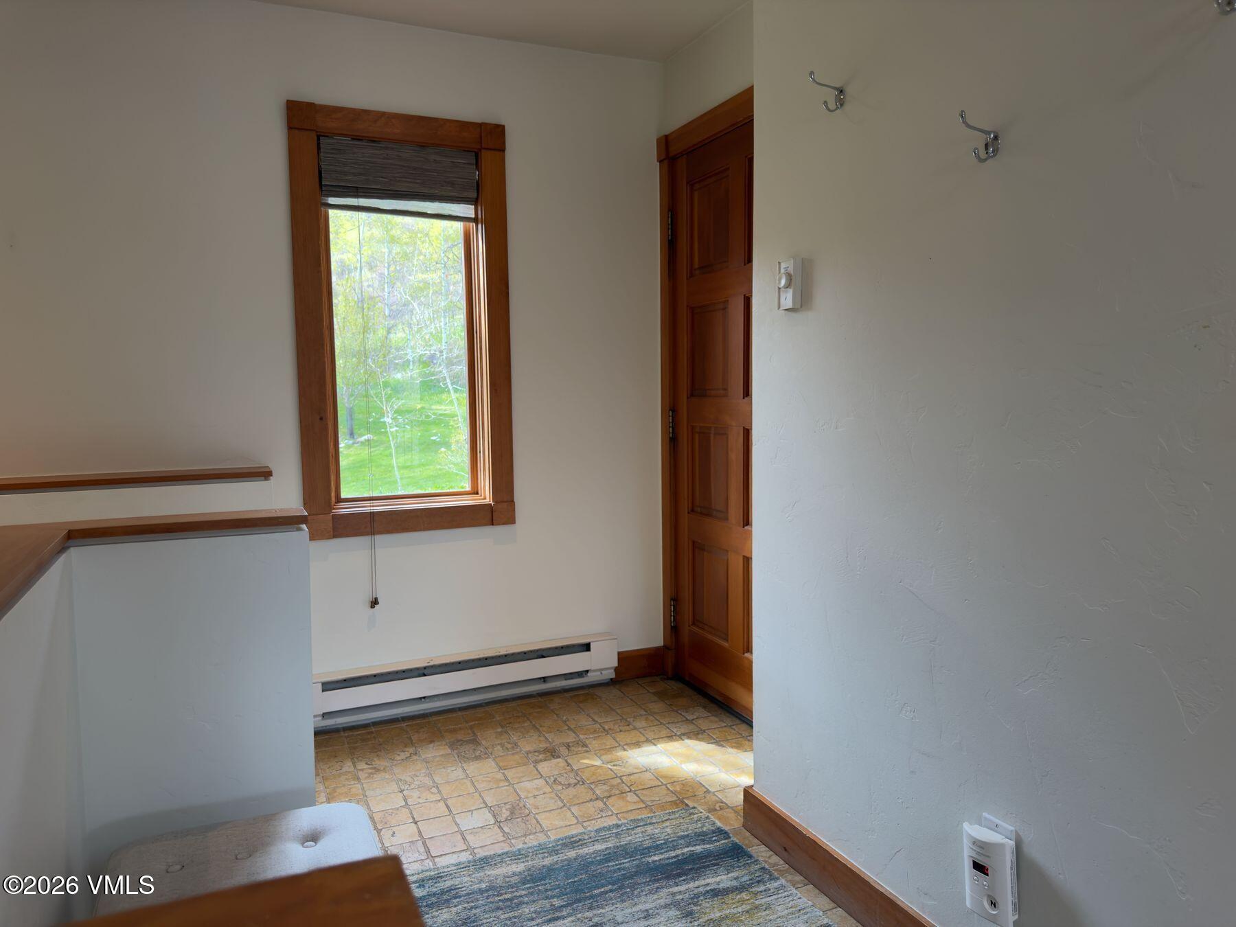2875 Manns Ranch Road, Unit J2 Vail, CO 81657 - Photo 9 of 25 a view of room with window and wooden floor