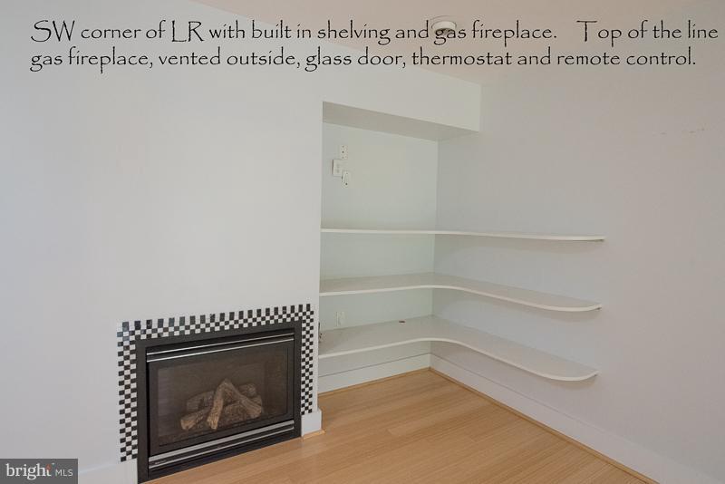 11302 Gatesborough Lane Reston, VA 20191 - Photo 5 of 30 a view of a room with wooden floor and a fireplace