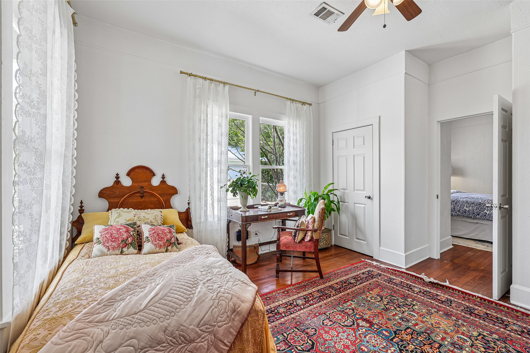 372 Old Lockhart Road Lockhart, TX 78644 - Photo 25 of 40 Rich hardwood flooring anchors this light-filled room with generous windows and classic moldings.