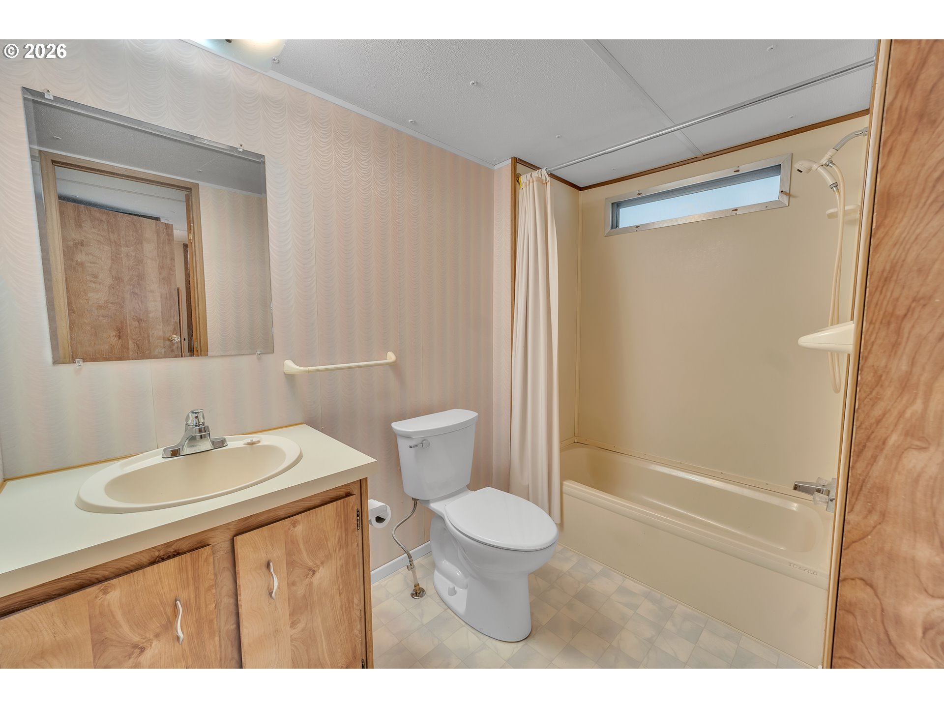 3137 Rainbow Loop Hubbard, OR 97032 - Photo 19 of 27 a bathroom with a sink a toilet a mirror and shower
