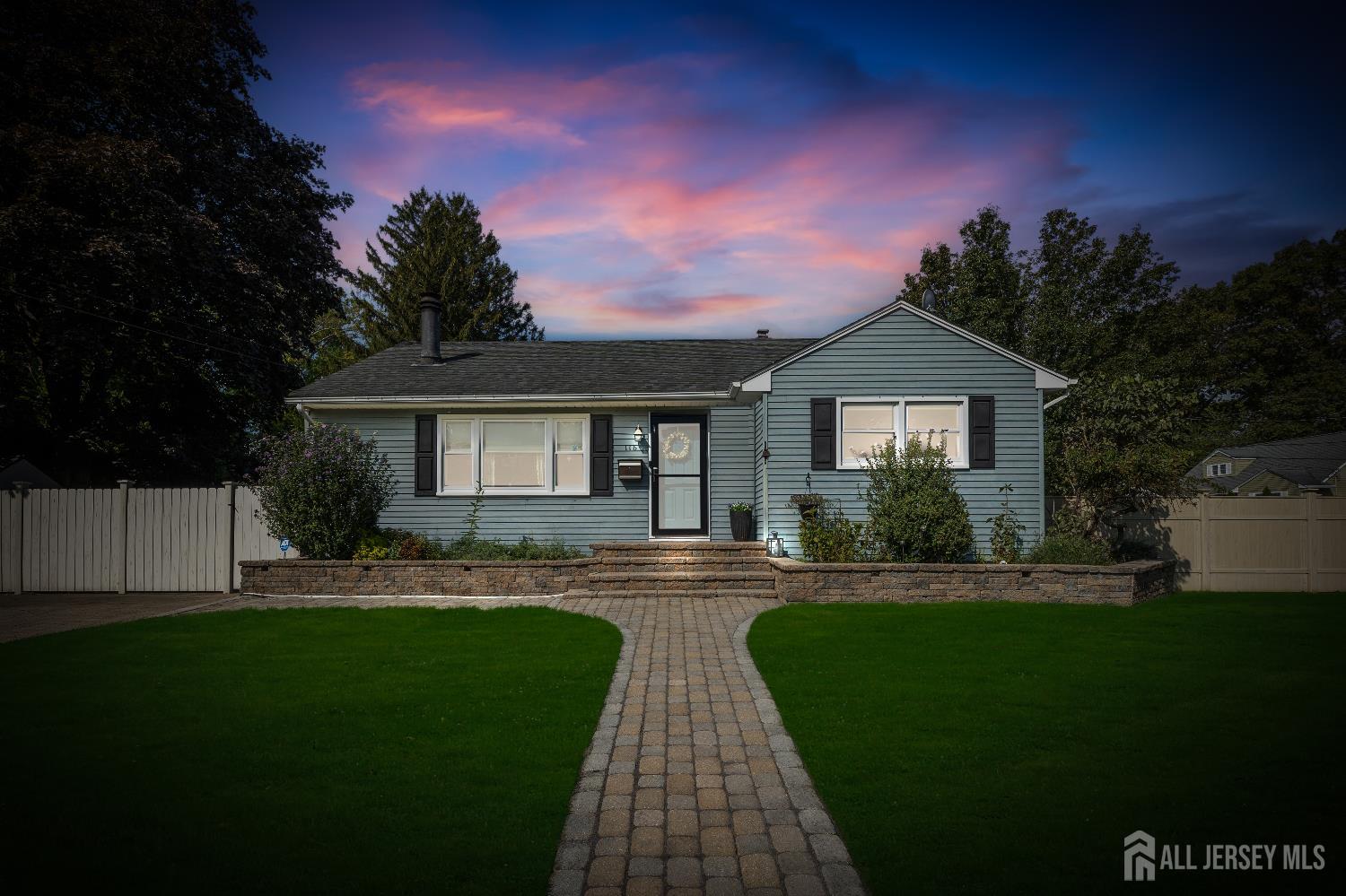 a view of house with a yard