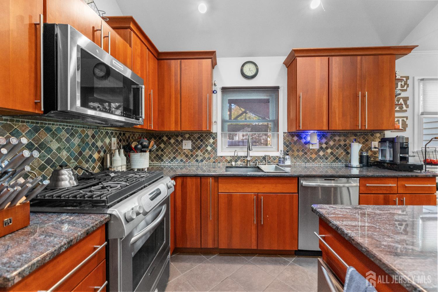 116 Player Avenue Edison, NJ 08817 - Photo 12 of 40 a kitchen with stainless steel appliances granite countertop a sink and a microwave