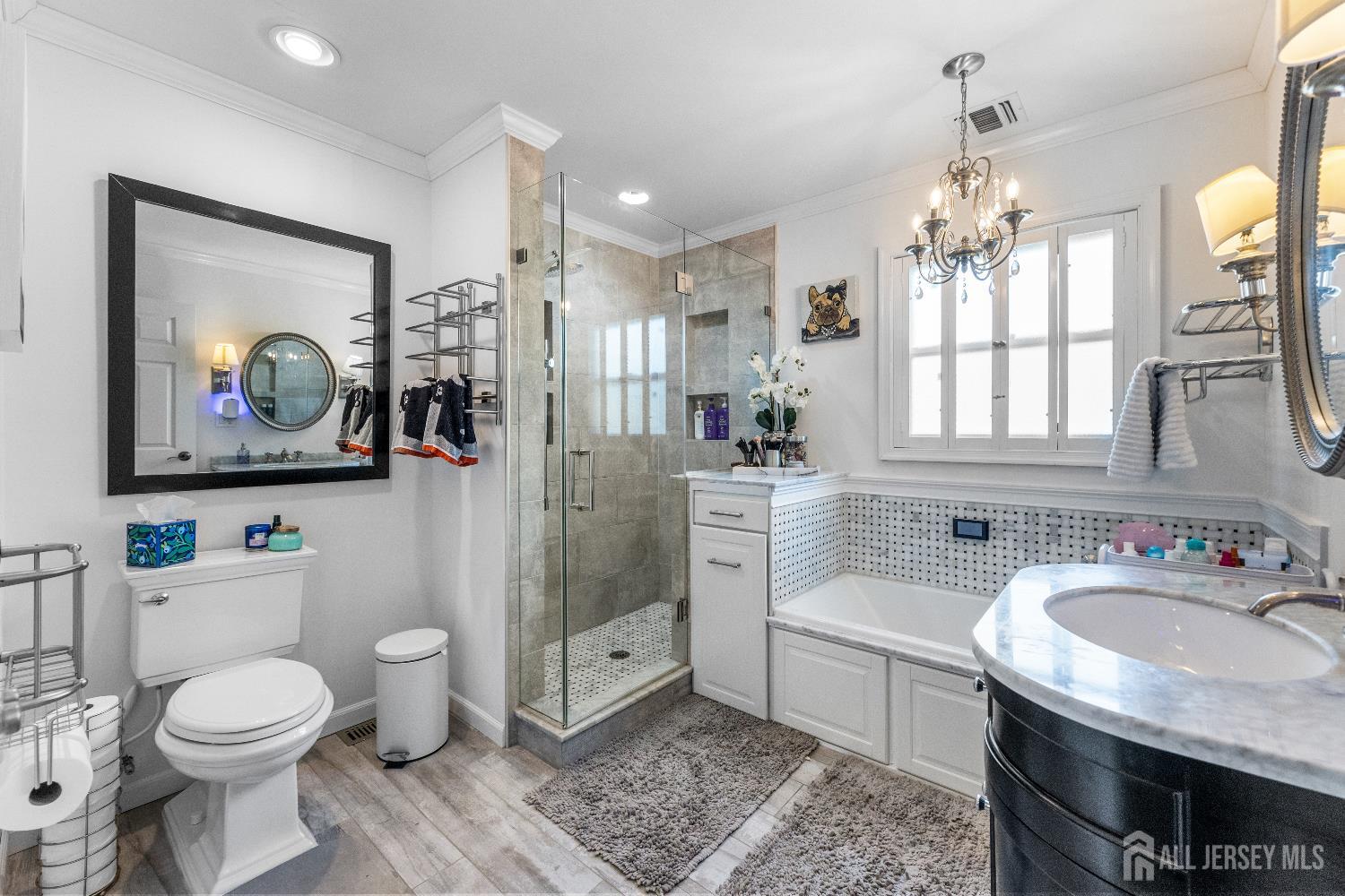 116 Player Avenue Edison, NJ 08817 - Photo 15 of 40 a spacious bathroom with a granite countertop sink a mirror a bathtub and a toilet