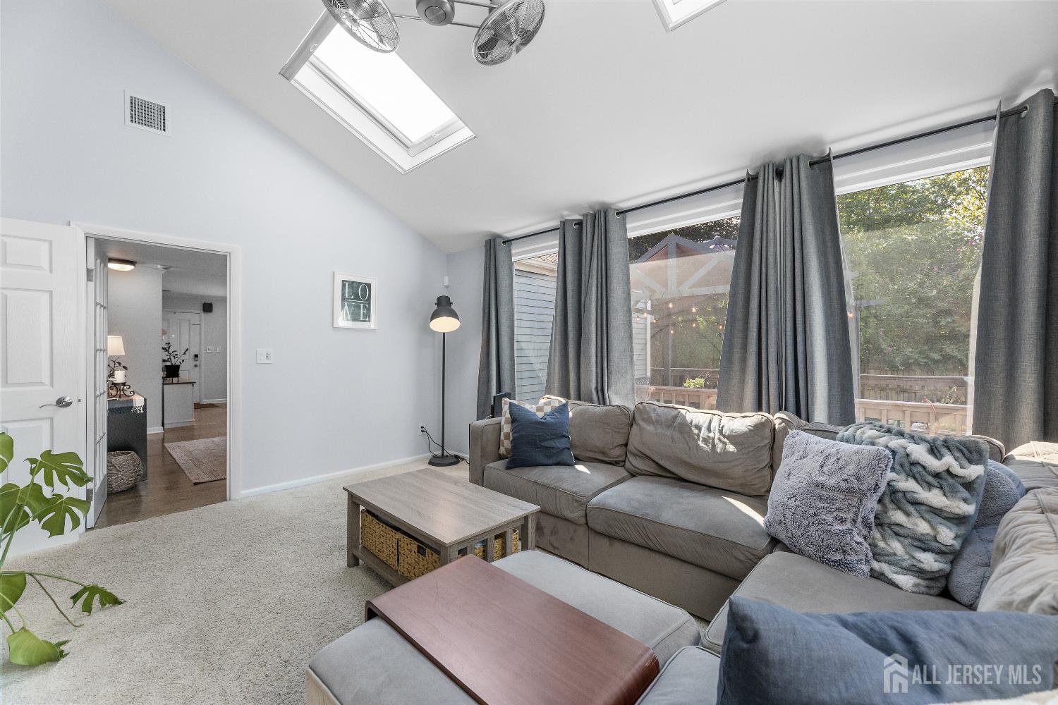 116 Player Avenue Edison, NJ 08817 - Photo 17 of 40 a living room with furniture and a large window