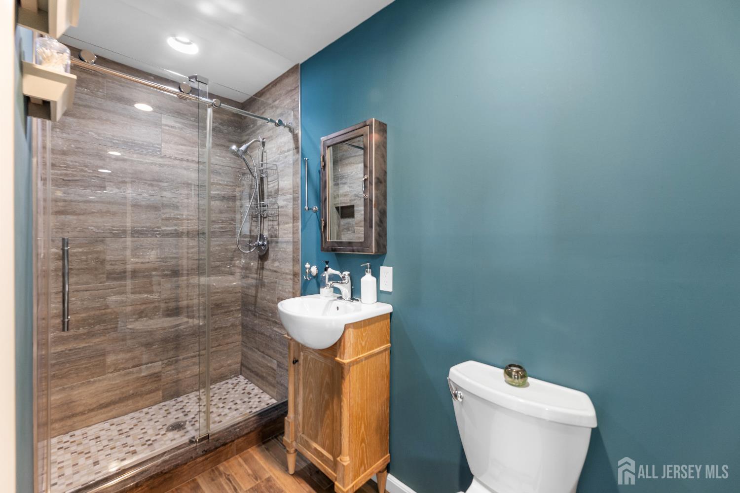 116 Player Avenue Edison, NJ 08817 - Photo 19 of 40 a bathroom with a toilet sink and shower