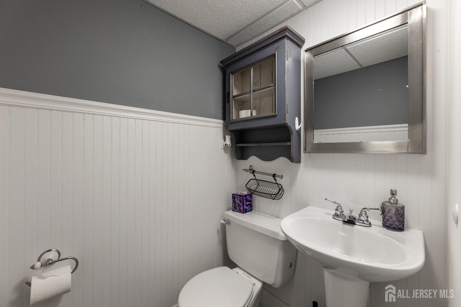 116 Player Avenue Edison, NJ 08817 - Photo 22 of 40 a bathroom with a sink toilet and mirror