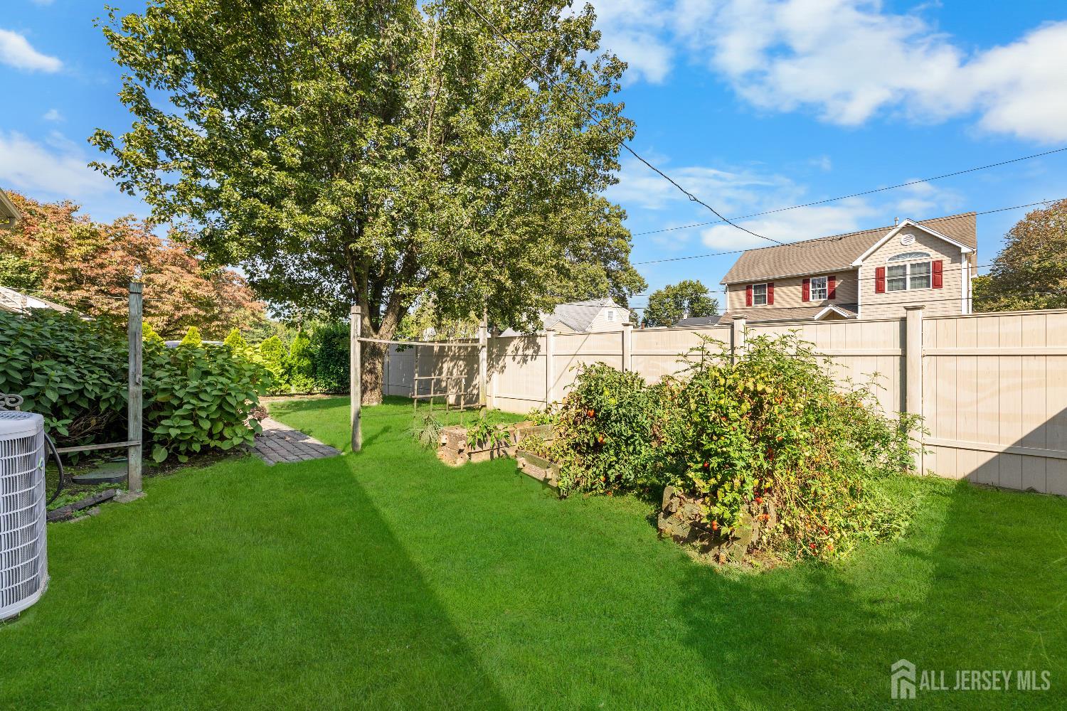 116 Player Avenue Edison, NJ 08817 - Photo 27 of 40 a front view of a house with a yard