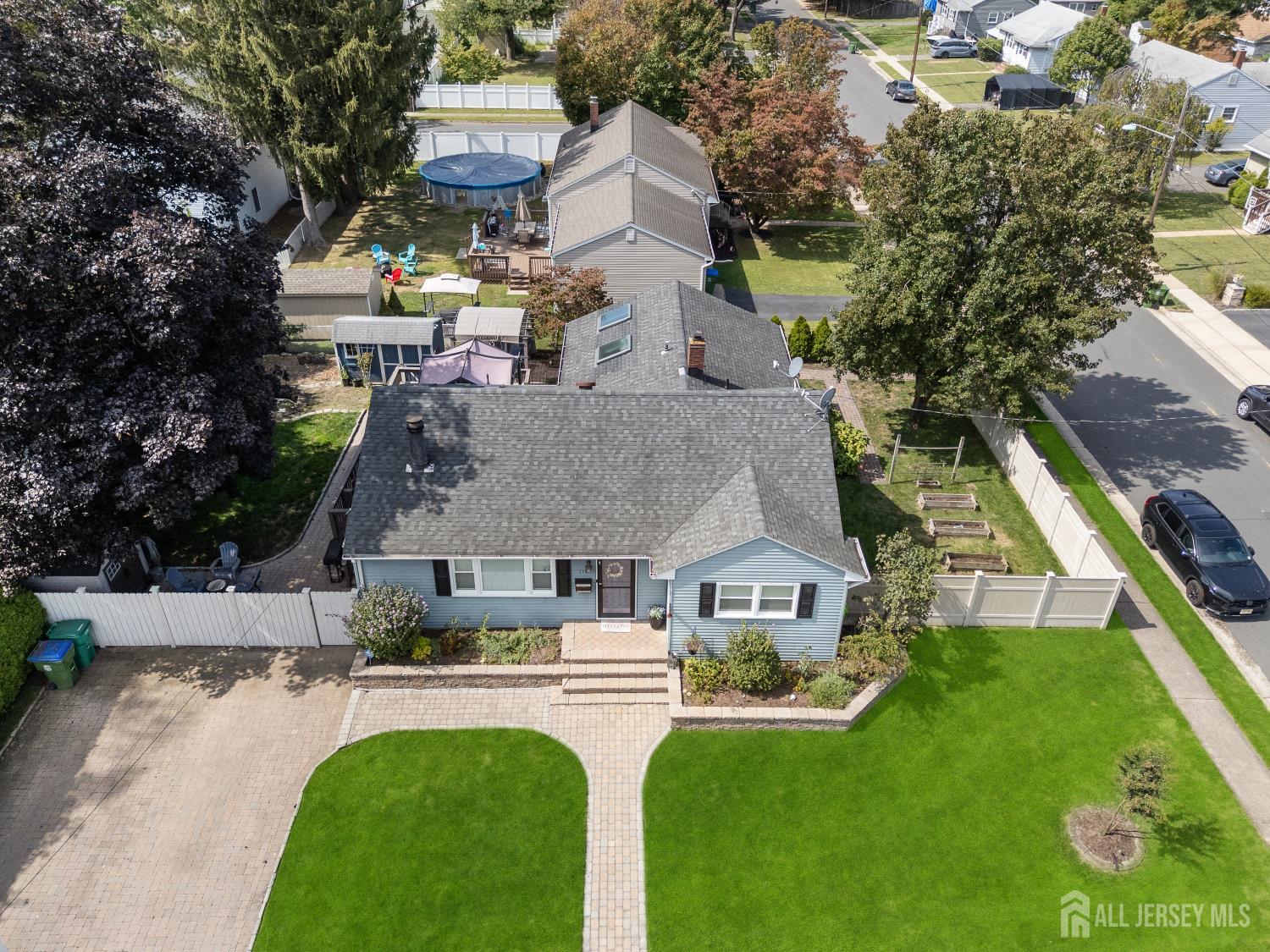 116 Player Avenue Edison, NJ 08817 - Photo 30 of 40 a aerial view of a house with swimming pool and porch