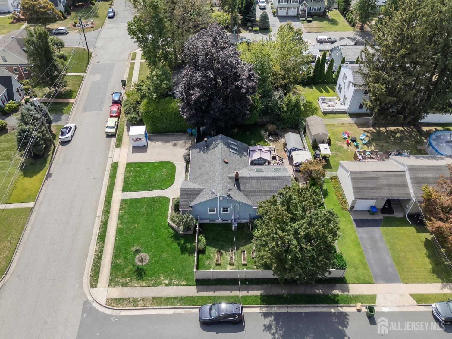 116 Player Avenue Edison, NJ 08817 - Photo 32 of 40 an aerial view of a house with a yard and potted plants