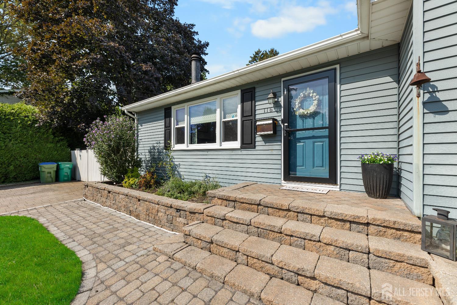 116 Player Avenue Edison, NJ 08817 - Photo 4 of 40 a front view of a house with garden