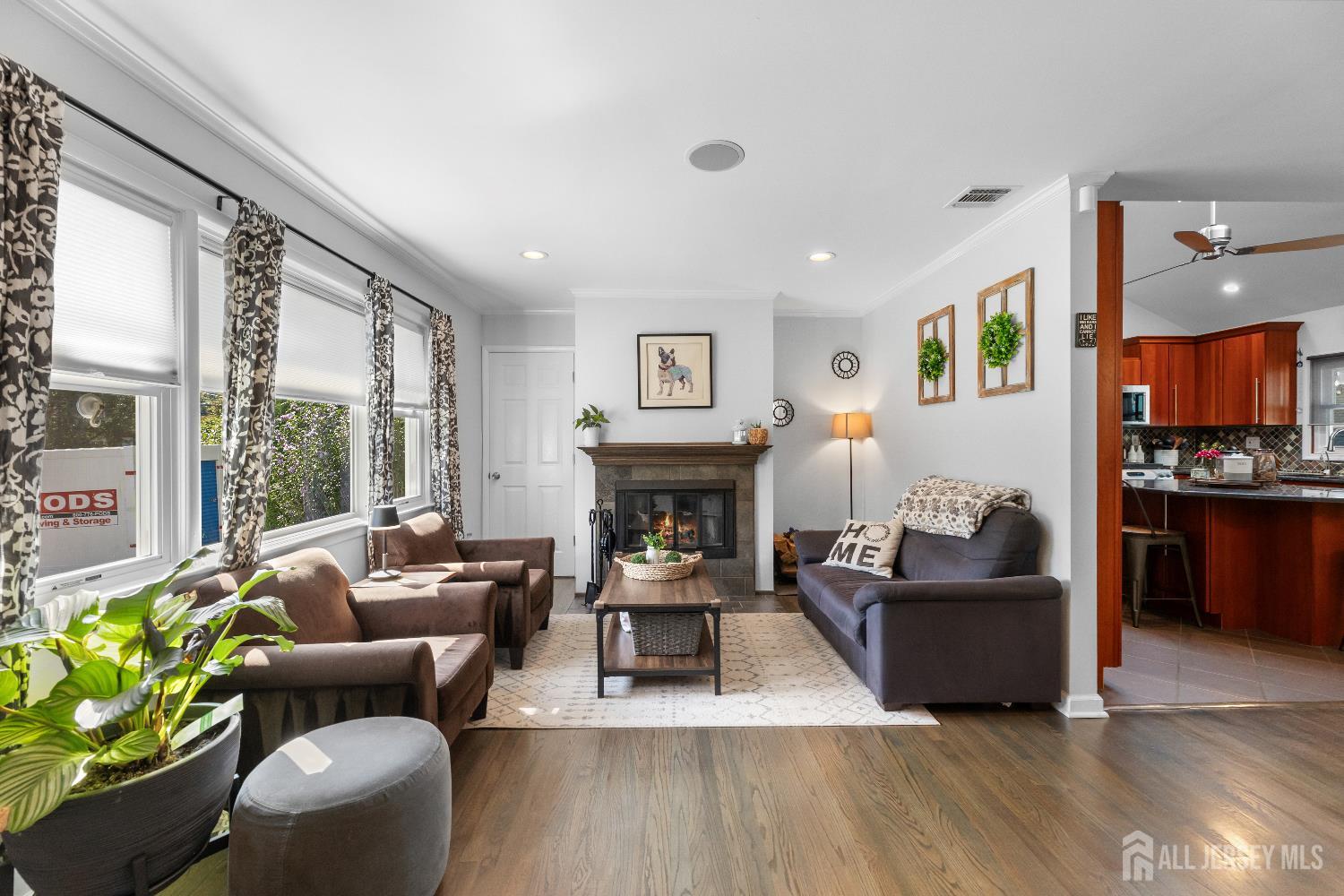 116 Player Avenue Edison, NJ 08817 - Photo 5 of 40 a living room with furniture a large window and a fireplace