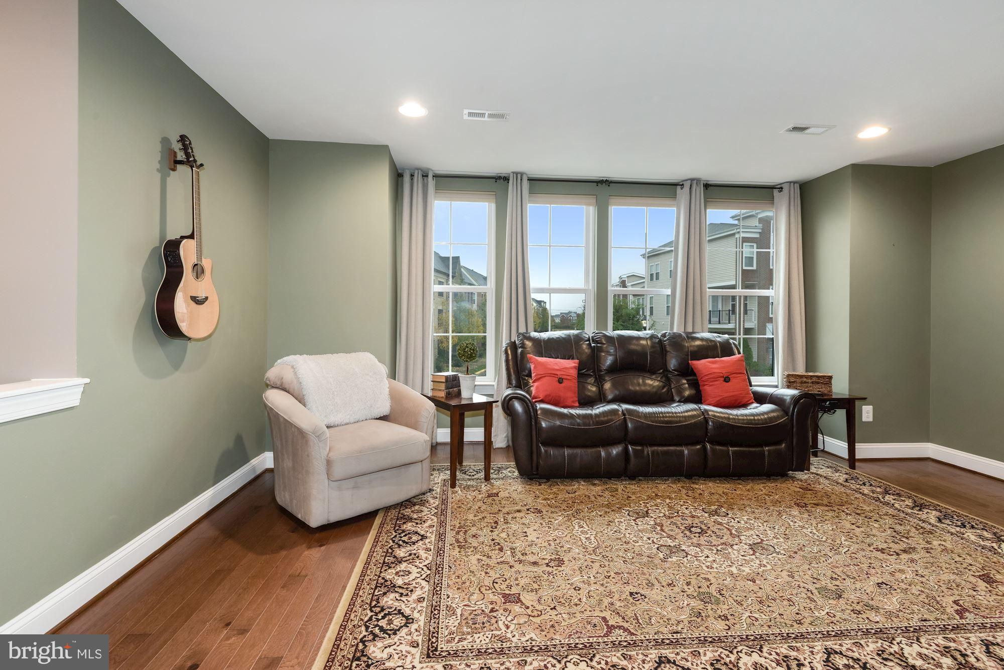 23524 Epperson Square Brambleton, VA 20148 - Photo 6 of 36 Step up to the Library/Family Room