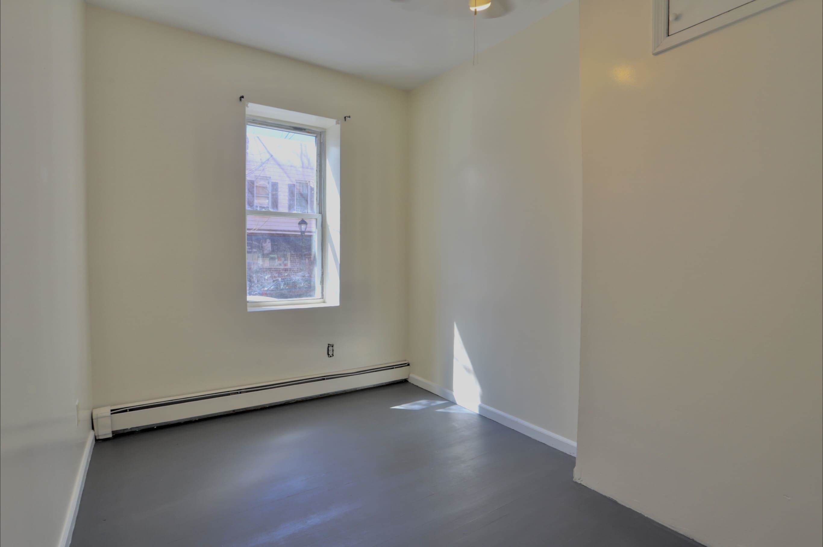 314 Paterson Plank Road, Unit 1B Union City, NJ 07087 - Photo 13 of 22 an empty room with a window
