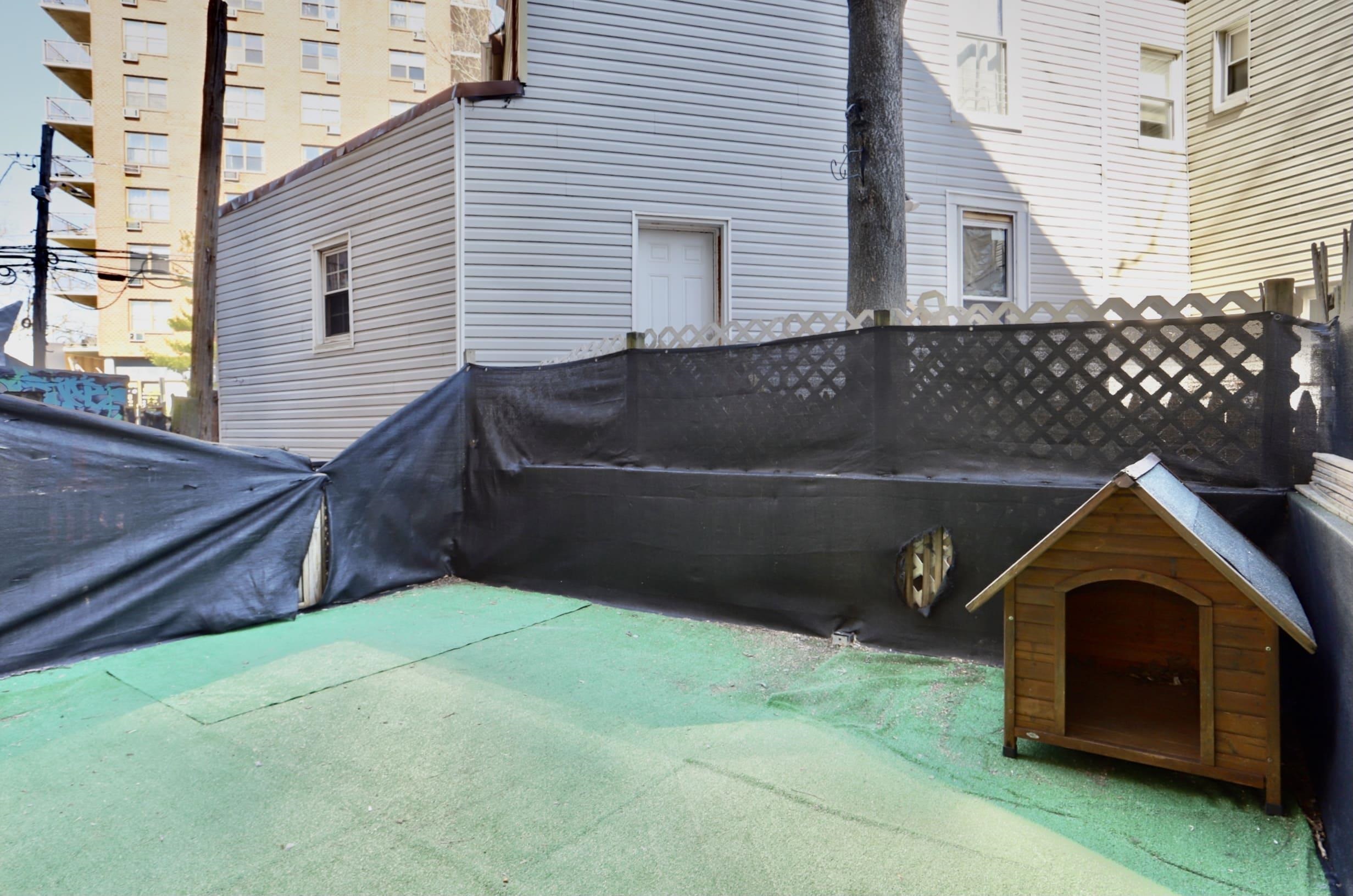 314 Paterson Plank Road, Unit 1B Union City, NJ 07087 - Photo 16 of 22 a front view of a house with a yard