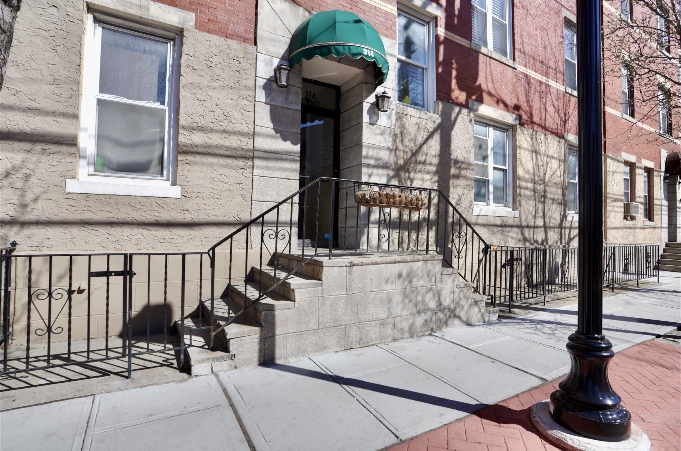 314 Paterson Plank Road, Unit 1B Union City, NJ 07087 - Photo 18 of 22 a view of a brick house with large windows