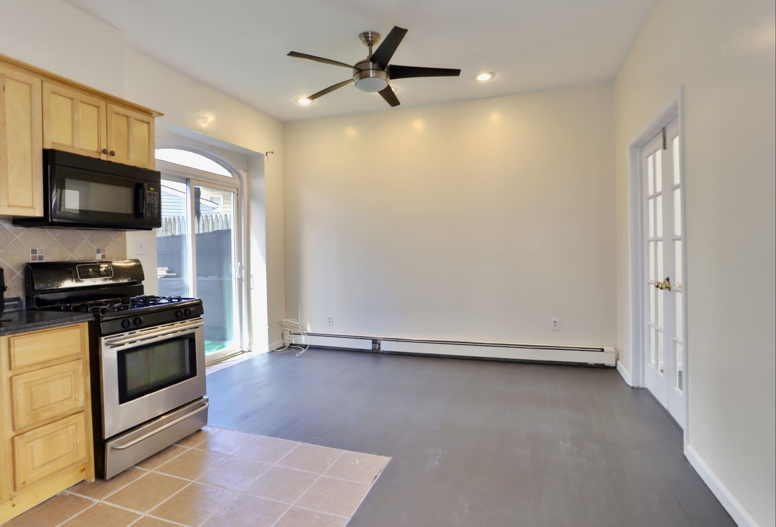 314 Paterson Plank Road, Unit 1B Union City, NJ 07087 - Photo 7 of 22 a living room with stainless steel appliances granite countertop a stove a sink and a refrigerator