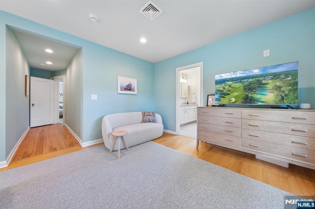 34 Prescott Avenue Montclair, NJ 07042 - Photo 20 of 40 a bedroom with a bed and a flat screen tv