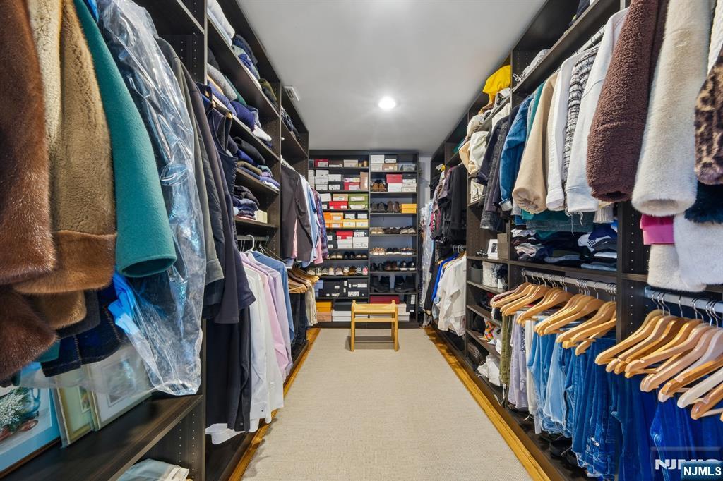 34 Prescott Avenue Montclair, NJ 07042 - Photo 21 of 40 a view of walk in closet with clothes and shoes