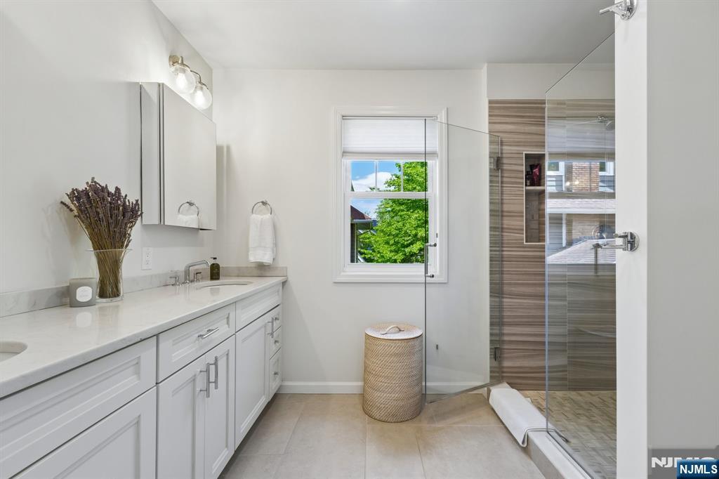 34 Prescott Avenue Montclair, NJ 07042 - Photo 22 of 40 a bathroom with a granite countertop sink a toilet and shower