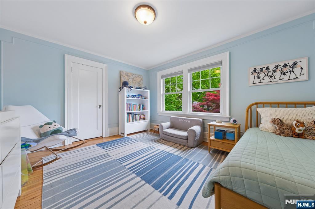 34 Prescott Avenue Montclair, NJ 07042 - Photo 25 of 40 a bedroom with furniture and a large window