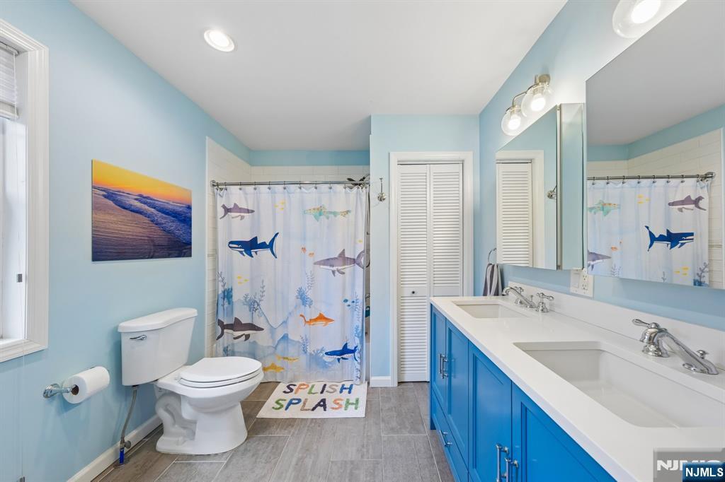 34 Prescott Avenue Montclair, NJ 07042 - Photo 26 of 40 a bathroom with a toilet sink and mirror