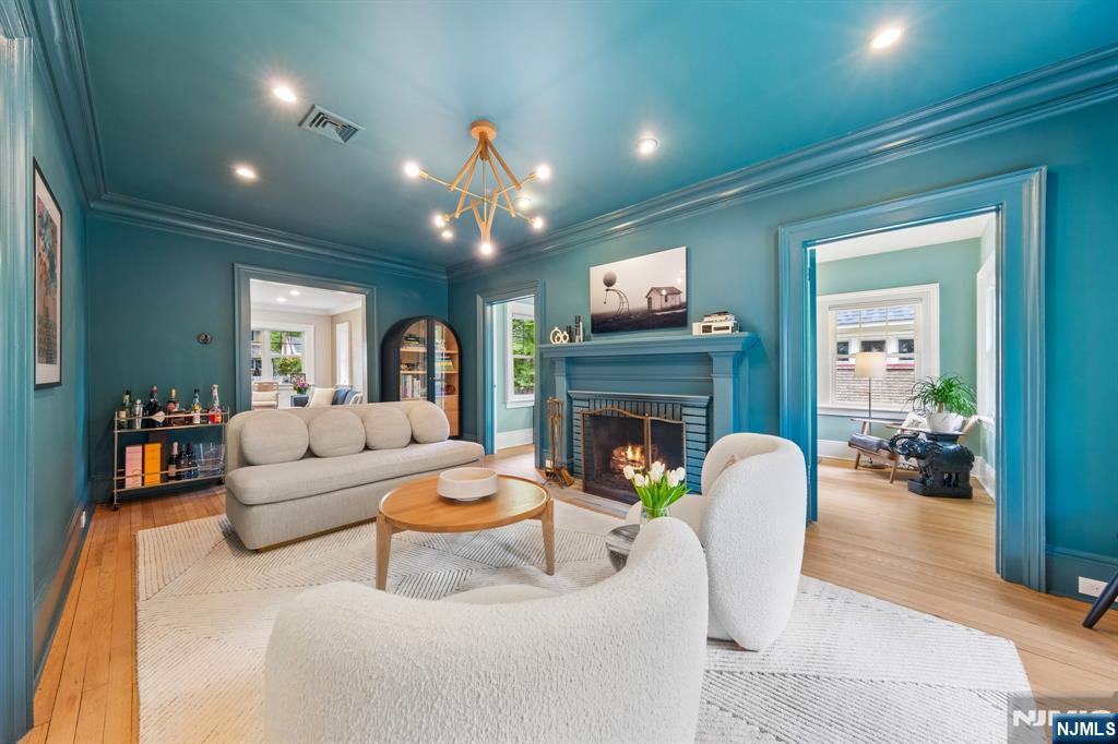 34 Prescott Avenue Montclair, NJ 07042 - Photo 5 of 40 a living room with furniture and a fireplace