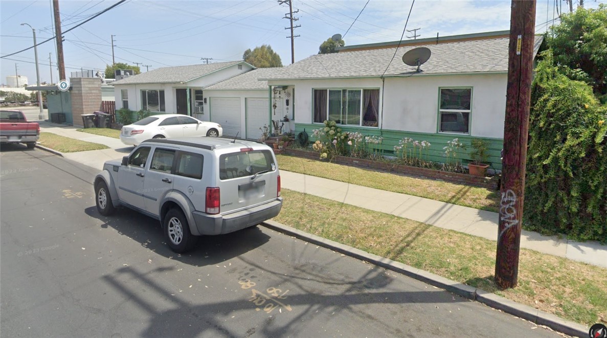 5959 Cherry Avenue Long Beach, CA 90805 - Photo 2 of 11 a white car parked in front of a house