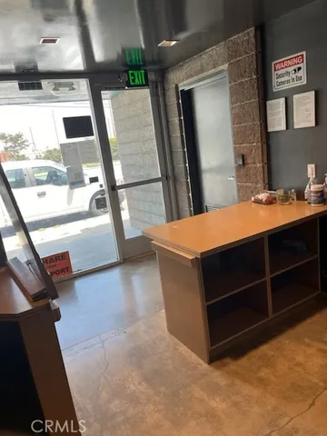 a room with pool table and a window