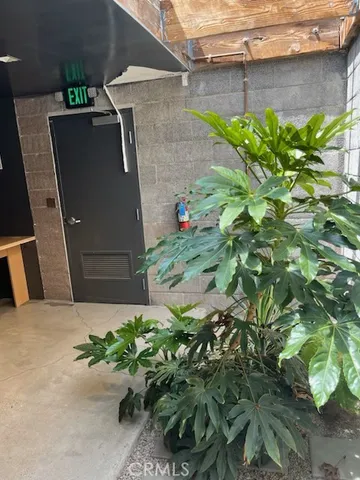 a backyard of a house with a yard and outdoor seating