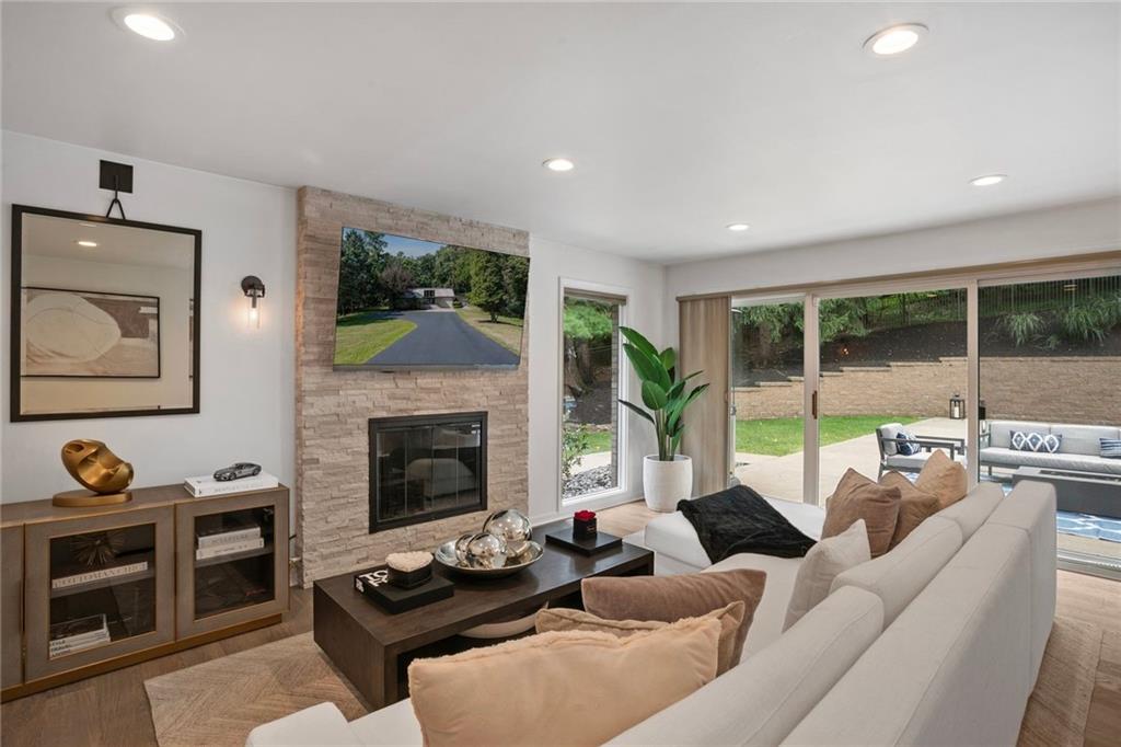 989 Braddock Road Pittsburgh, PA 15221 - Photo 15 of 50 a living room with furniture and a fireplace