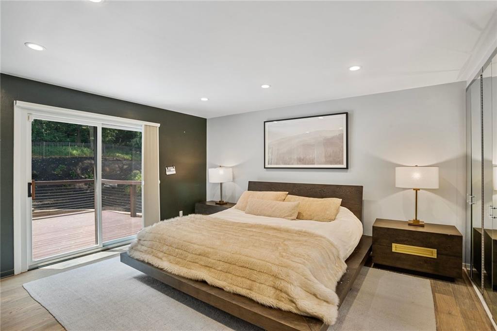 989 Braddock Road Pittsburgh, PA 15221 - Photo 20 of 50 a bedroom with a large bed and a lamp