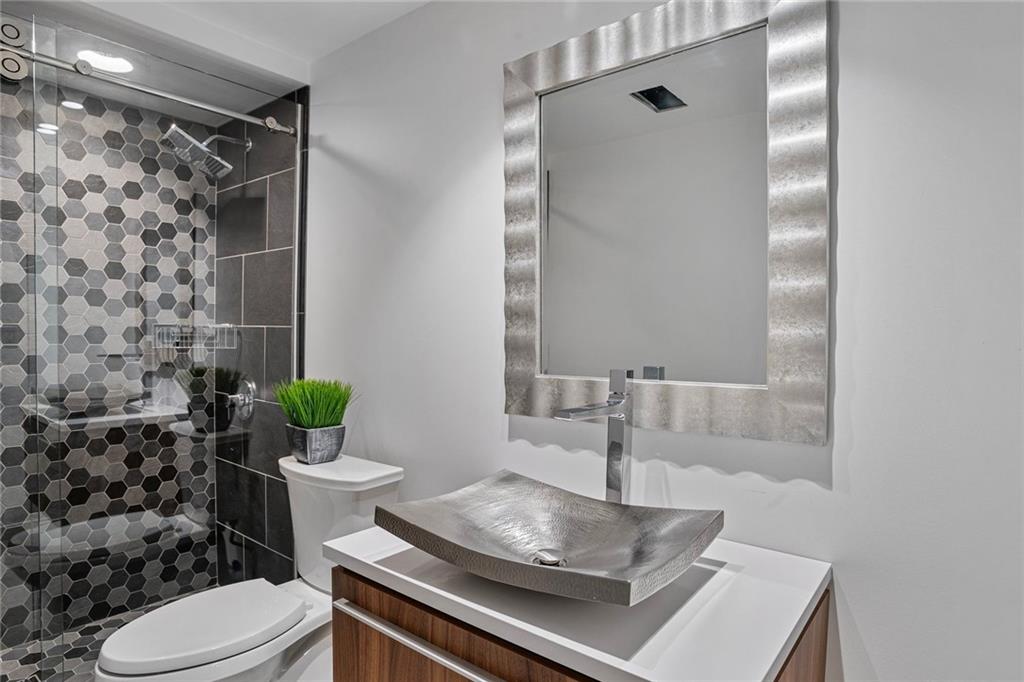 989 Braddock Road Pittsburgh, PA 15221 - Photo 39 of 50 a bathroom with a sink toilet and shower