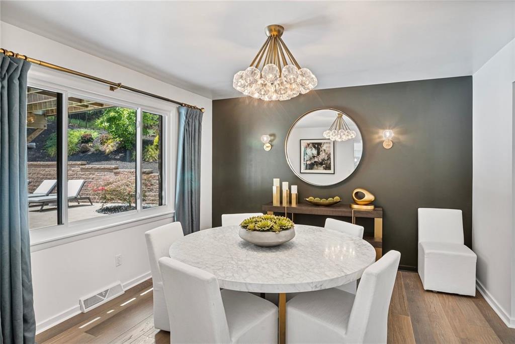 989 Braddock Road Pittsburgh, PA 15221 - Photo 7 of 50 a view of a dining room with furniture window and wooden floor