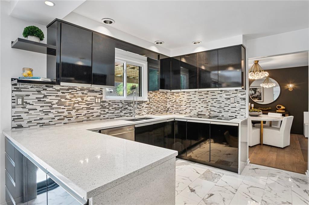 989 Braddock Road Pittsburgh, PA 15221 - Photo 10 of 50 a kitchen with a stove and a sink