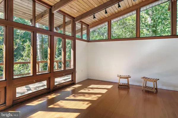 a view of an entryway with wooden floor