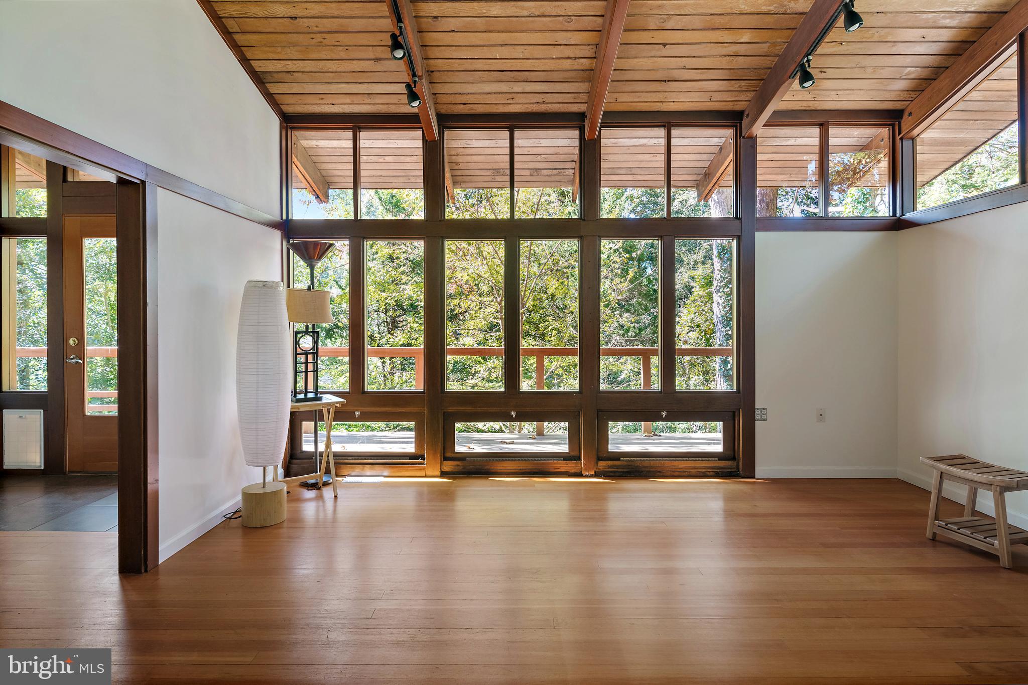 245 Haverton Road Arnold, MD 21012 - Photo 22 of 53 a view of an empty room with wooden floor and a window
