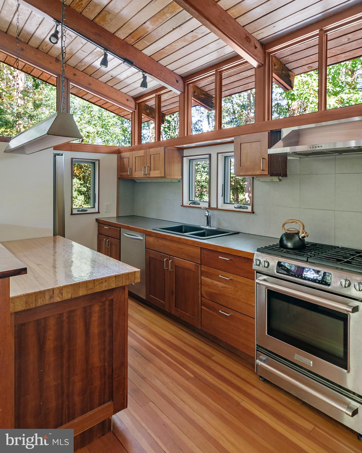 245 Haverton Road Arnold, MD 21012 - Photo 33 of 53 a kitchen with stainless steel appliances granite countertop a stove a sink and a microwave